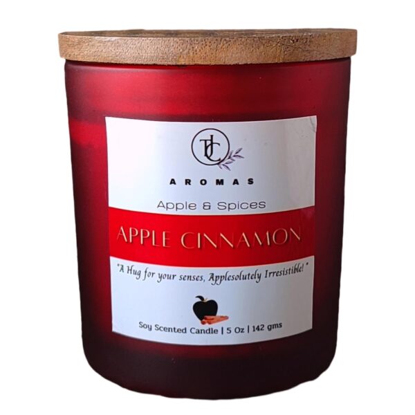 apple cinnamon scented candle on white background